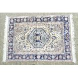 Carpet / Rug: a hand woven silk rug with central hexagonal light blue ground,