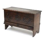 A late 17thC elm mule chest / coffer of small proportions with a carved front above a single long