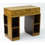 An early / mid 20thC oak Heals style desk,