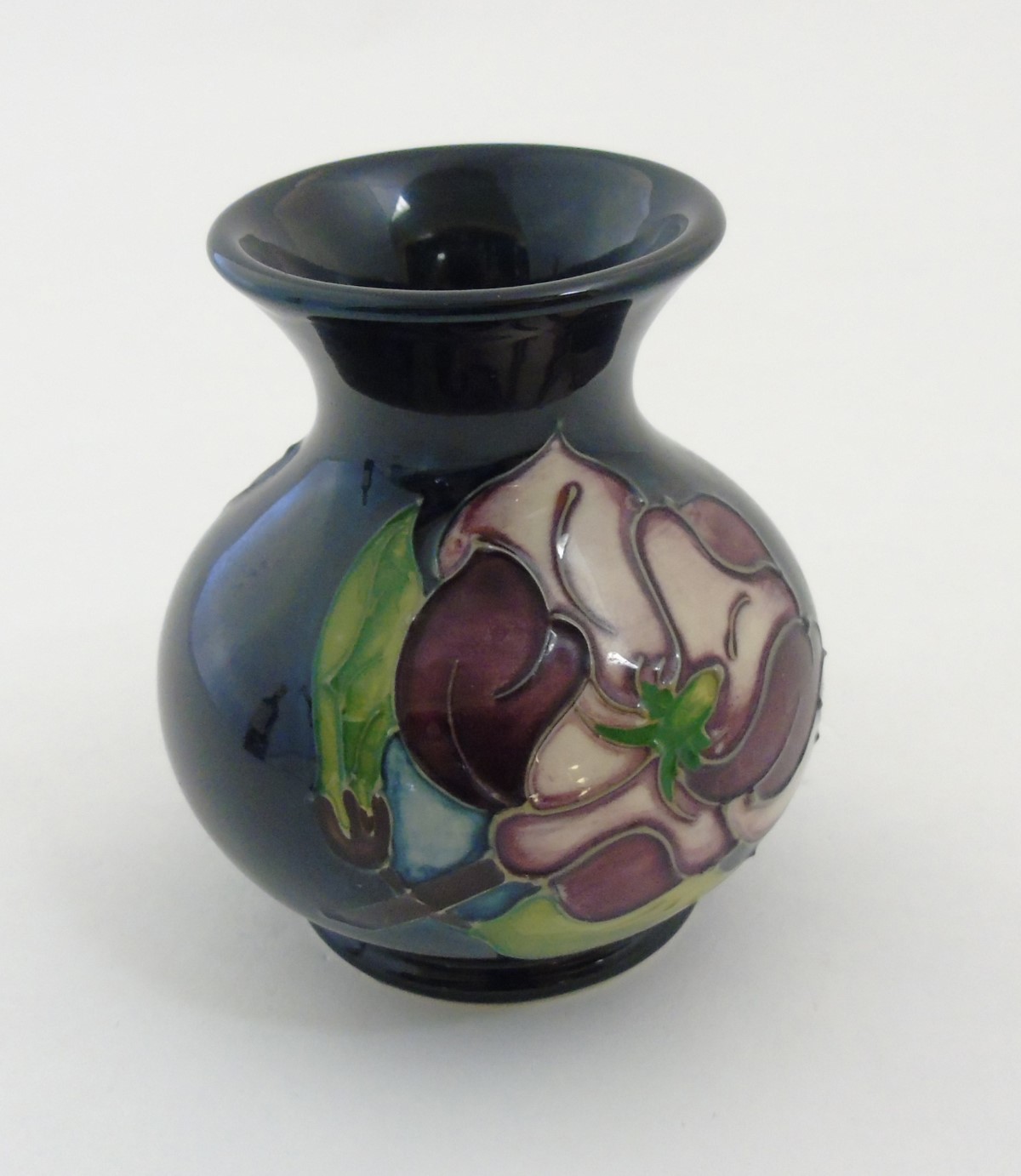 A 1994 Moorcroft Magnolia vase on dark blue ground, makers mark to base, - Image 2 of 6