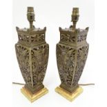 French Table lamps: a pair of ornate squared cast and fretted gilt bronze, early 19thC,