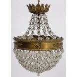 Drop bag light fitting: an electric ornate cut glass and brass pendant light fitting with acanthus