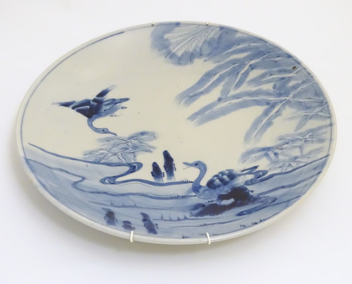 An oriental blue and white charger with hand painted decoration of birds in a landscape. Approx. - Image 3 of 4