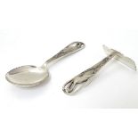 A child's silver spoon / pusher with stork / crane decoration to handle.