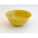 A Chinese Imperial yellow glazed, incised dragon bowl , decorated with 5 clawed dragon and phoenix ,