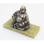 A silver plate on copper oriental figural sculpture of Buddha on onyx base.