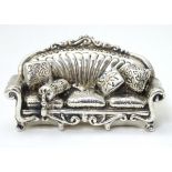 A miniature silver model of a sofa marked .925.