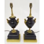 A pair of Regency styles patinated bronze,