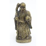 A XX Chinese hollow cast brass figure of Shou, a Chinese Diety, holding his staff and a peach,