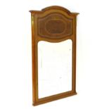 An early 20thC mahogany over mantle mirror with ormolu mounts,