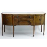 An early 20thC mahogany bow fronted sideboard,