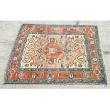 Carpet / Rug : a hand woven woollen rug with central hexagonal red ground with pale yellow,