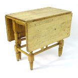 A Victorian pine gate leg table with single short drawer to one end.