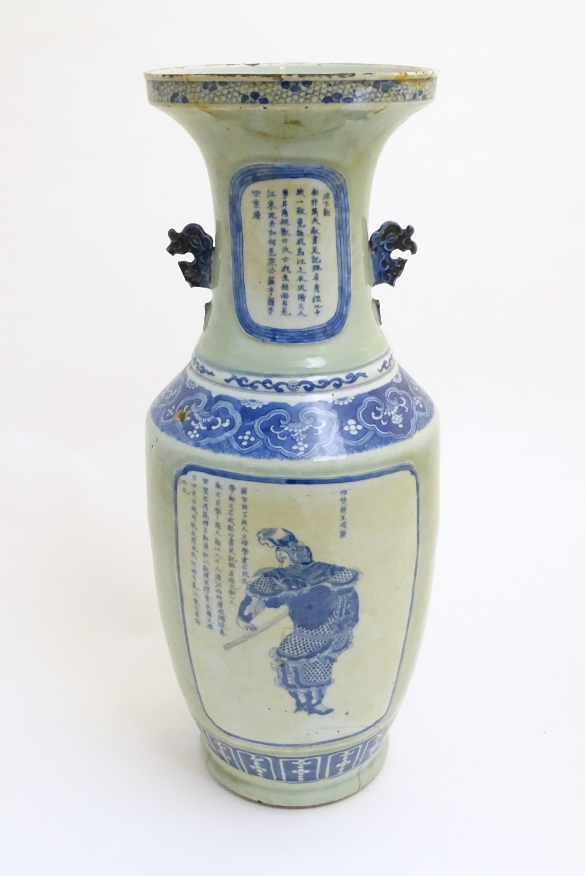 A large blue and white baluster vase with a celadon-like ground and twin handles.