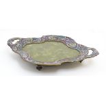 A late 19thC brass quatrefoil shaped 2-handed tray/ dish with cloisonné enamelled border and green
