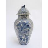 A blue and white hexagonal lidded ginger jar by W. M.