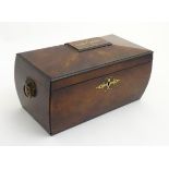 An early 19thC bowed sarcophagus mahogany tea caddy with brass inlay and cast scallop and ring drop