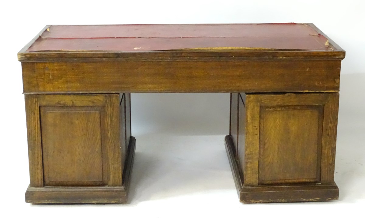 An early 20thC oak pedestal desk comprising a single long central drawer flanked by four short - Image 4 of 7