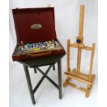 A quantity of paints and an easel CONDITION: Please Note - we do not make reference