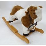 A upholstered rocking horse CONDITION: Please Note - we do not make reference to