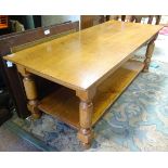 A rectangular oak two-tier cantilever table CONDITION: Please Note - we do not