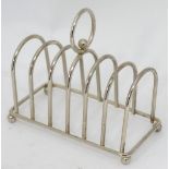 A silver plated 6 section toast rack with central loop handle CONDITION: Please Note