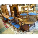 A large dining room suite, comprising a dining table with 10 chairs, a sideboard,