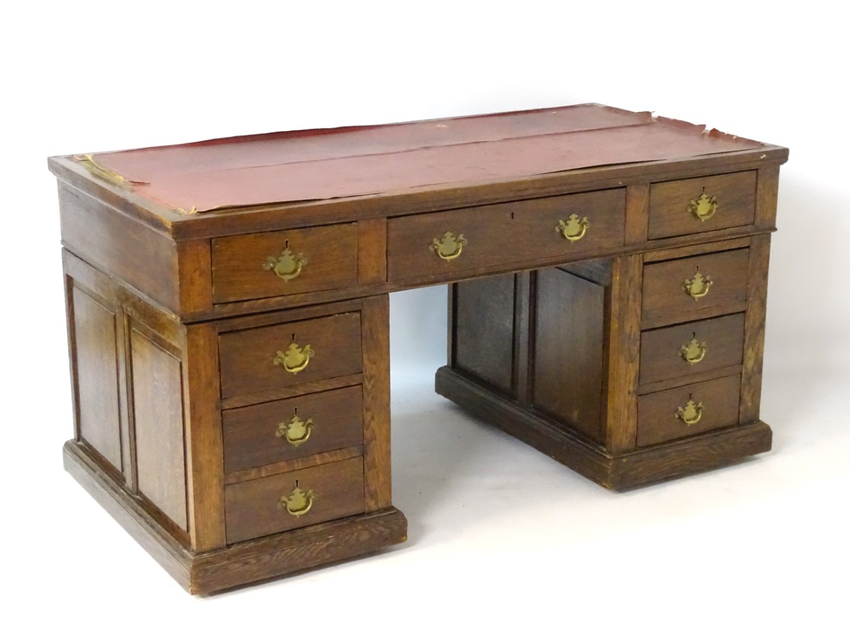 An early 20thC oak pedestal desk comprising a single long central drawer flanked by four short - Image 6 of 7