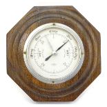 A 20thC Aneroid Barometer: An octagonal oak cased barometer by SB, with a silvered 4" dial,