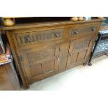 A 20thC oak and elm sideboard,