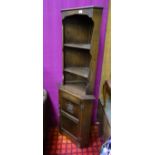 An oak corner cupboard with rose detail CONDITION: Please Note - we do not make