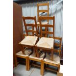 6 ladder back, rush seated modern dining chairs.