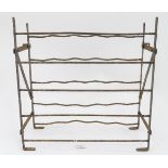 A cast iron wine rack CONDITION: Please Note - we do not make reference to the