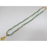 A cased jadite and silvergilt necklace CONDITION: Please Note - we do not make