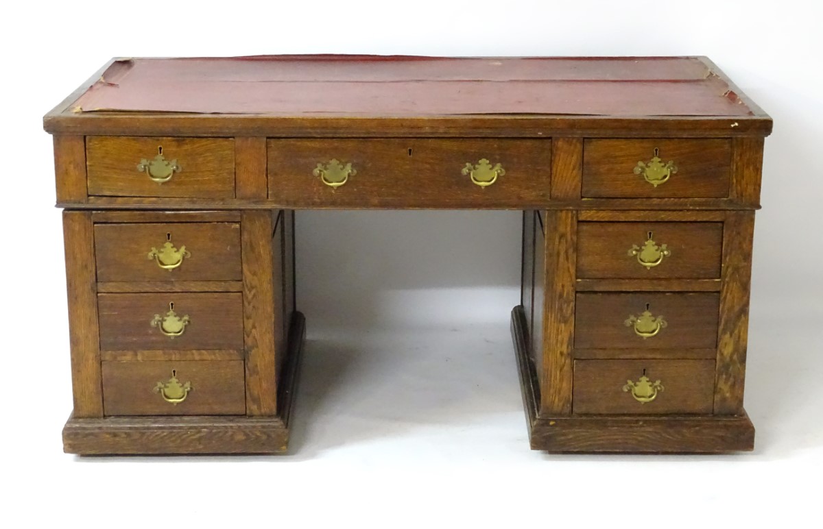 An early 20thC oak pedestal desk comprising a single long central drawer flanked by four short - Image 7 of 7