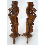 A pair of carved wooden stylised dragons CONDITION: Please Note - we do not make