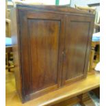 A mahogany wall cupboard CONDITION: Please Note - we do not make reference to the