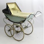 Royal Perambulator : A large sprung four wheel pram of oat shape with light blue and grey livery.