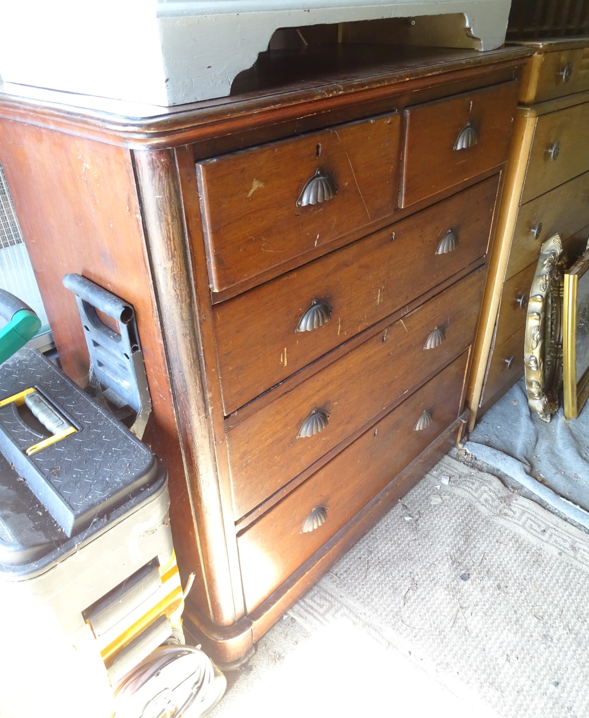 A late Victorian mahogany chest of drawers with shell handles CONDITION: Please Note