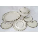 A quantity of creamware items comprising, soup tureen and stand, large meat plate etc.