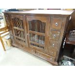 A large oriental cabinet with two ventilated central drawers CONDITION: Please Note