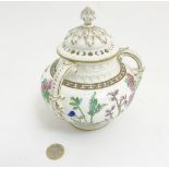 A late 19thC / early 20thC lidded Coalport 3 handled pot pourri pot with cover,