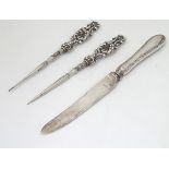 A pair of silver handled sewing tools hallmarked Birmingham 1903 maker Adie lovekin Ltd.