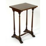 A William IV mahogany lamp table / occasional table with four turned tapering supports above a