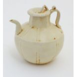 A Chinese white celadon style small proportion wine ewer,