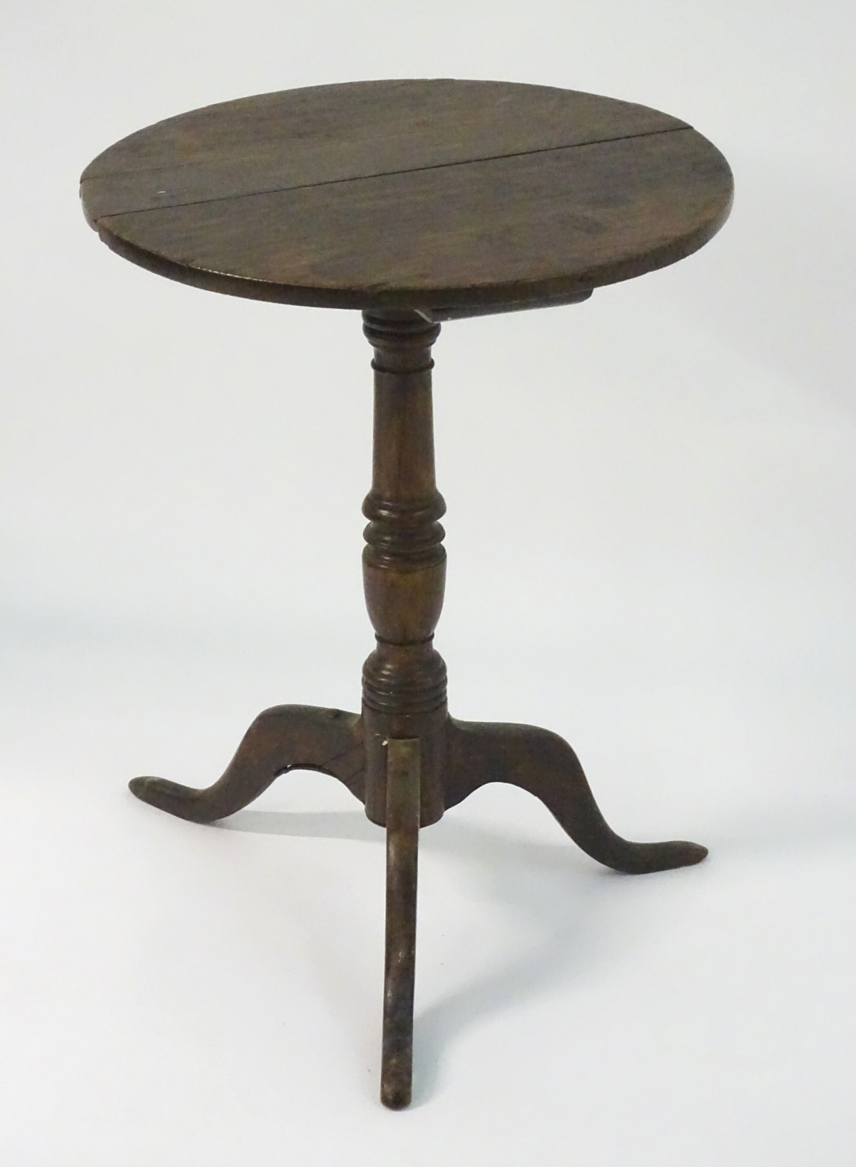 A late 18thC oak tripod table with a circular table top above a turned stem and standing on three - Image 2 of 7