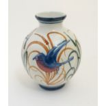 A Laurence McGowan British studio pottery globular vase decorated with hand painted birds in flight