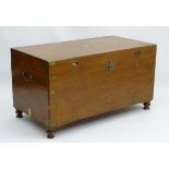 An early 20thC campaign chest with brass corner and side mounts,