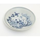 A small 18thC Chinese blue and white dish,