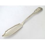 A Victorian silver fiddle shell and thread pattern butter knife hallmarked London 1841.